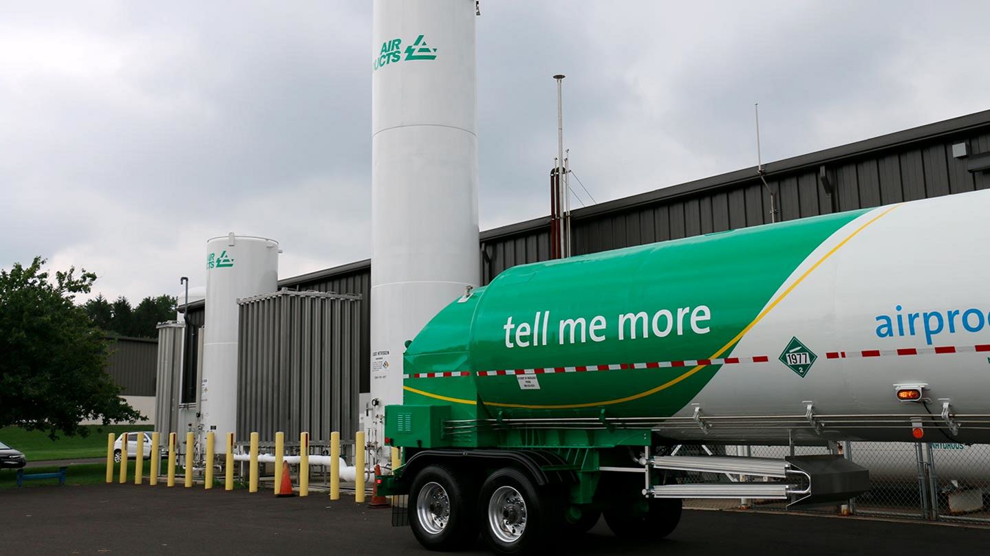 Air Products' cryogenic liquid storage tank and vaporizer beside a manufacturing facility