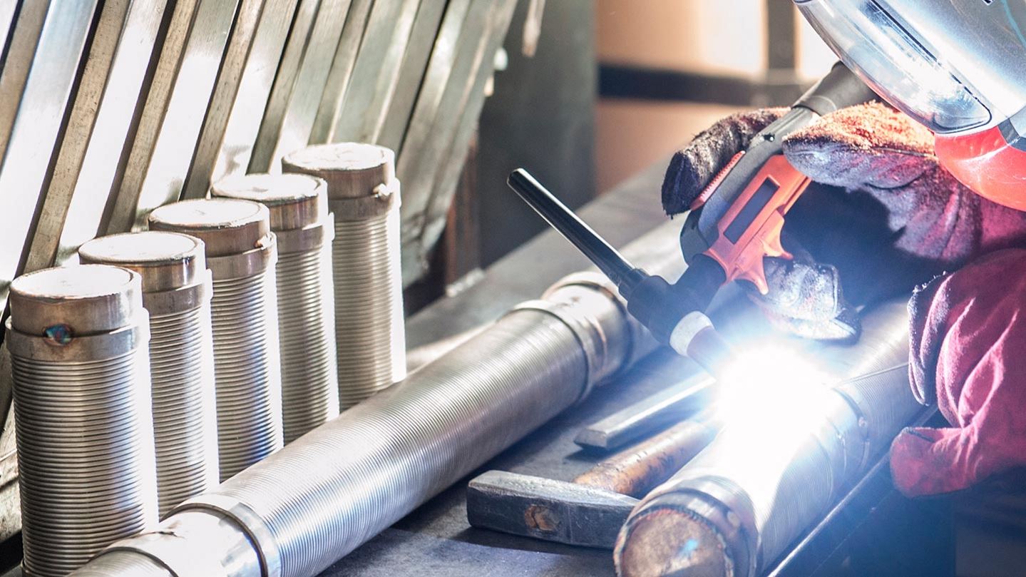 man welding wearing mask